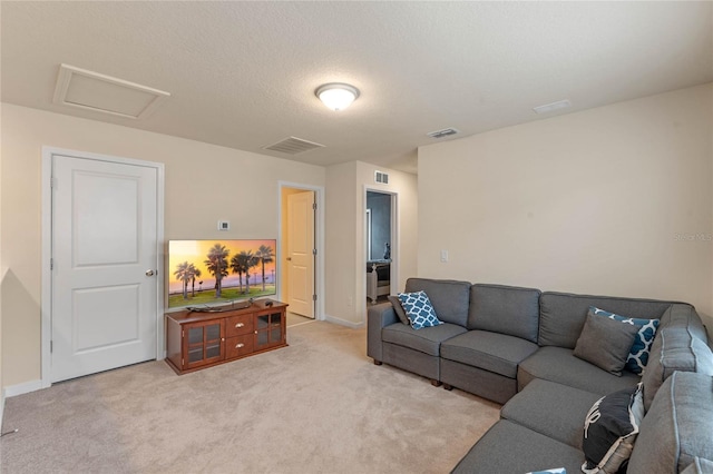 living room with light carpet and a textured ceiling