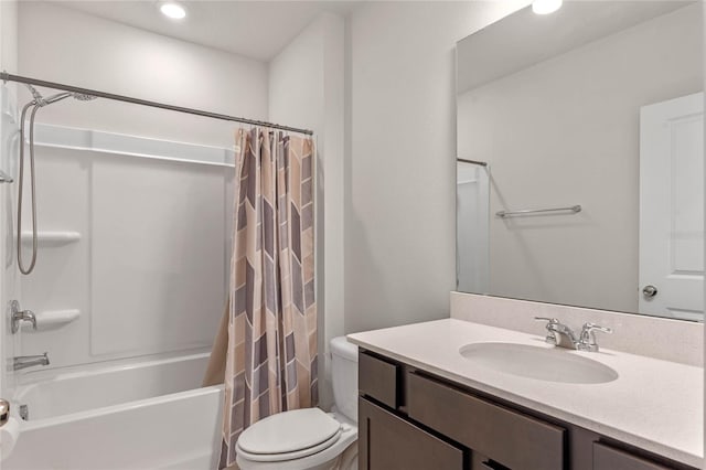 full bathroom featuring vanity, shower / bath combo, and toilet