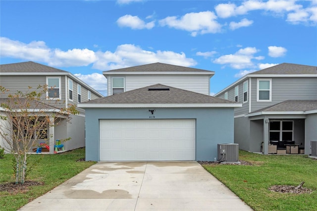 front facade featuring central AC, a front lawn, and a garage