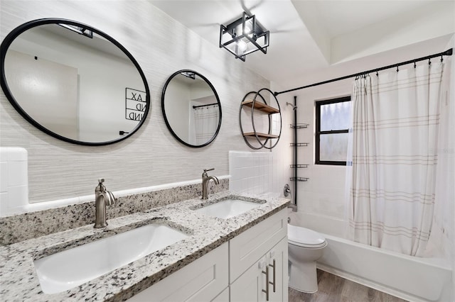 full bathroom with toilet, hardwood / wood-style floors, decorative backsplash, shower / tub combo, and vanity