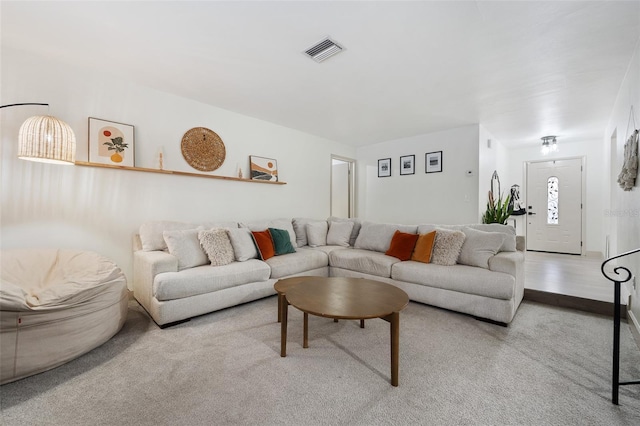 living room featuring light colored carpet