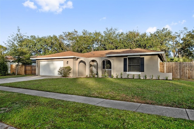 view of front of house with a front lawn and a garage