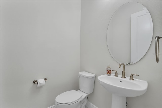 bathroom featuring toilet and sink