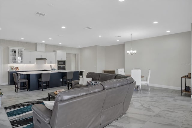 living room with an inviting chandelier