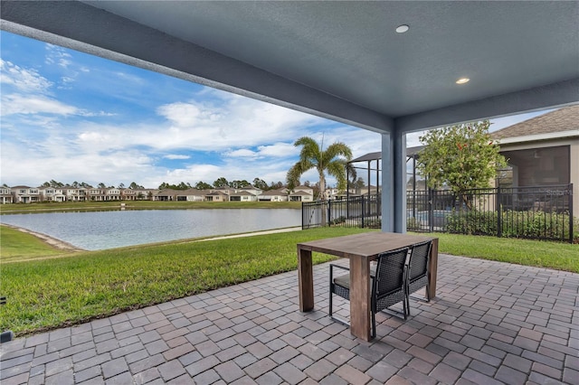 view of patio with a water view