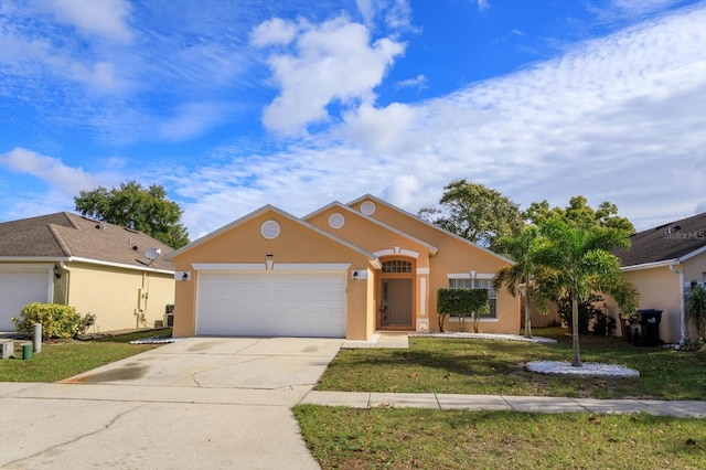 view of front of property featuring a front yard and a garage