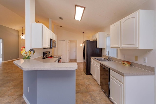 kitchen featuring white cabinets, sink, appliances with stainless steel finishes, decorative light fixtures, and kitchen peninsula