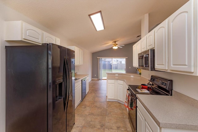 kitchen with kitchen peninsula, vaulted ceiling, ceiling fan, appliances with stainless steel finishes, and white cabinetry