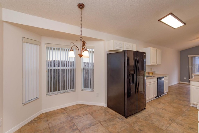 kitchen featuring black appliances, a textured ceiling, decorative light fixtures, white cabinetry, and a chandelier