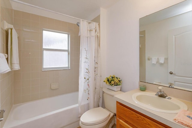 full bathroom with shower / bath combination with curtain, toilet, and vanity