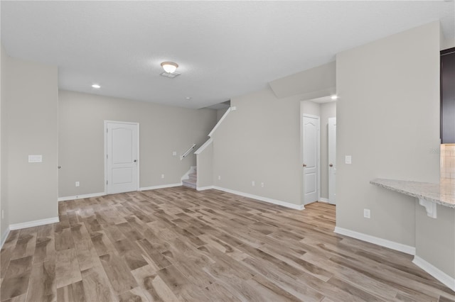 unfurnished living room with light wood-type flooring