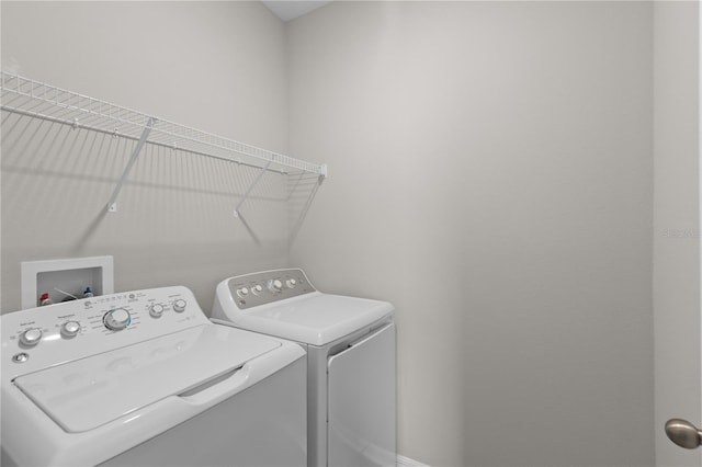 washroom featuring separate washer and dryer