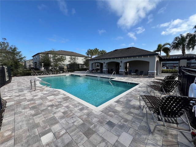 view of swimming pool with a patio