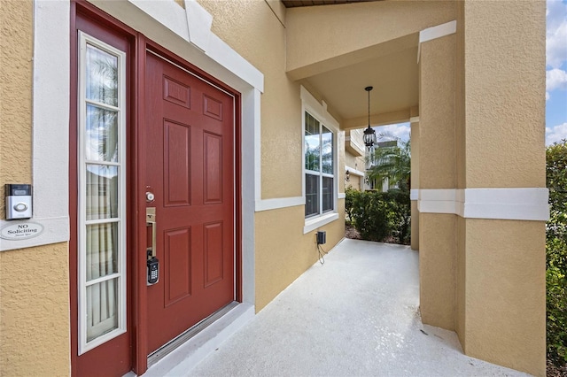 property entrance featuring a porch