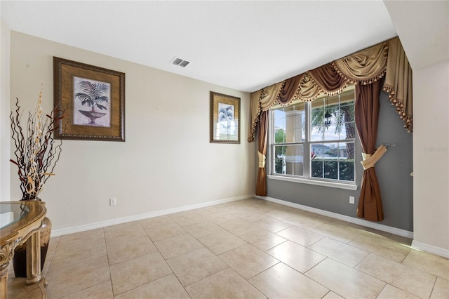 empty room with light tile patterned floors