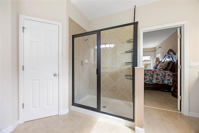 bathroom featuring tile patterned floors and a shower with door