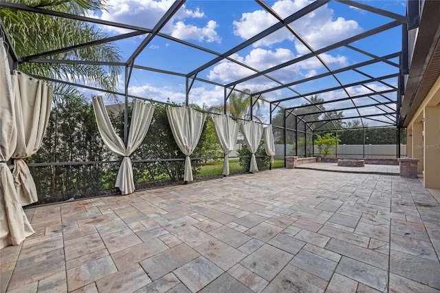 view of patio with a lanai