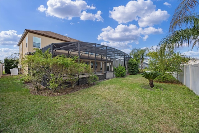 view of yard with glass enclosure