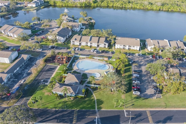 birds eye view of property with a water view