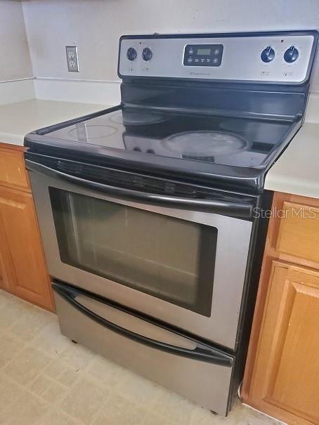 room details with stainless steel electric range oven