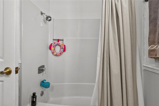 bathroom featuring shower / bathtub combination with curtain