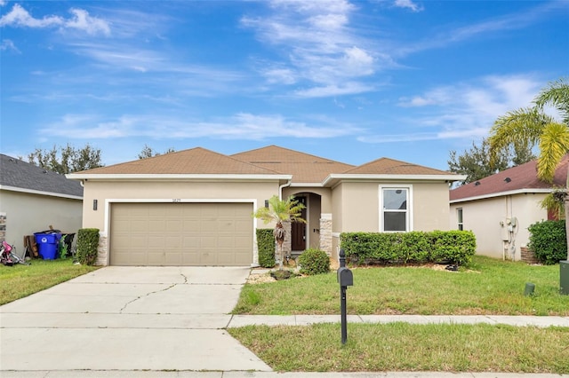 ranch-style home featuring a front lawn and a garage