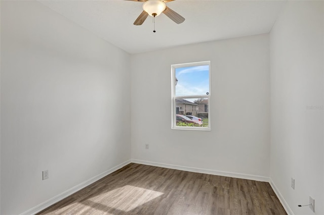 unfurnished room with ceiling fan and wood-type flooring