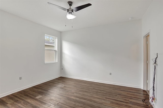 empty room featuring dark hardwood / wood-style floors and ceiling fan