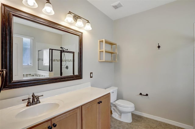 bathroom featuring vanity, a shower with shower door, and toilet