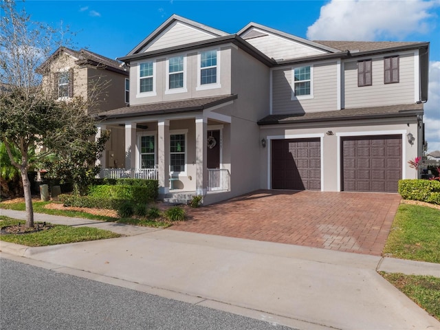 view of front of property with a porch and a garage