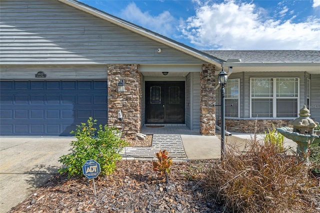 entrance to property featuring a garage