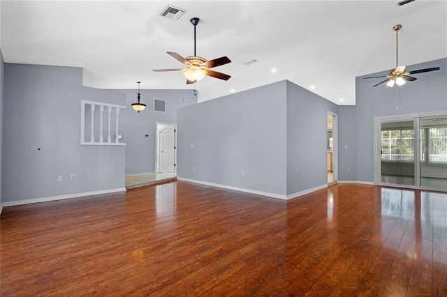 unfurnished living room featuring vaulted ceiling, ceiling fan, and dark wood-type flooring