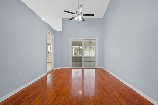 spare room with hardwood / wood-style flooring and ceiling fan