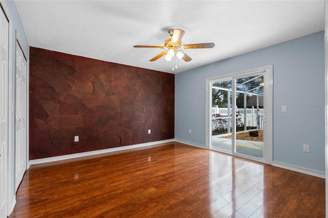 unfurnished room featuring ceiling fan and hardwood / wood-style floors