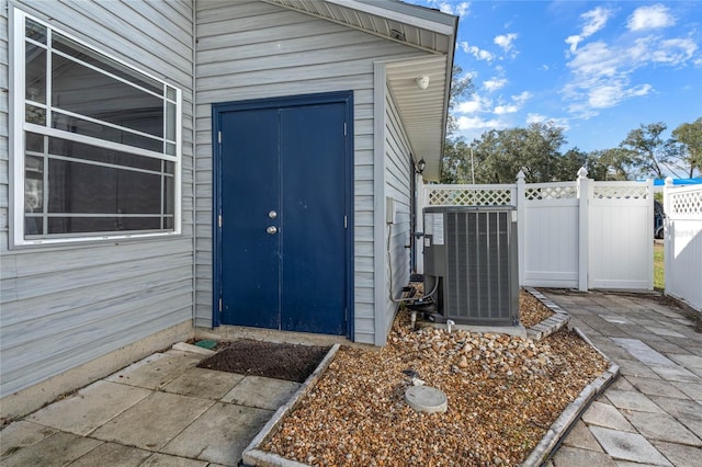 entrance to property with central AC unit