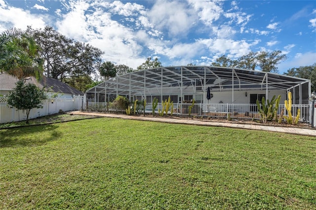 view of yard with glass enclosure