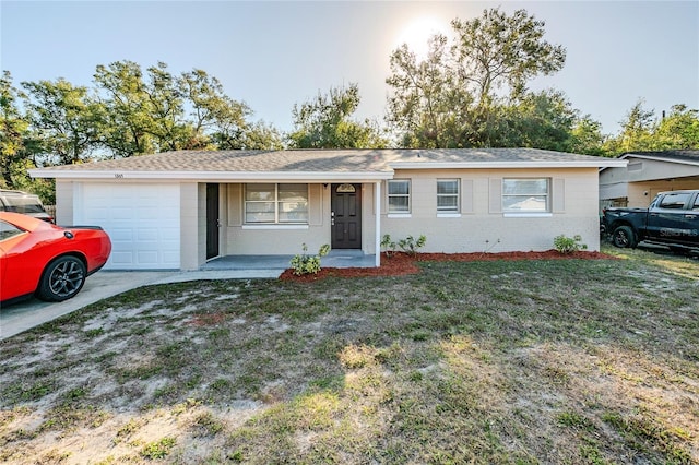 ranch-style home with a front yard, a garage, and covered porch