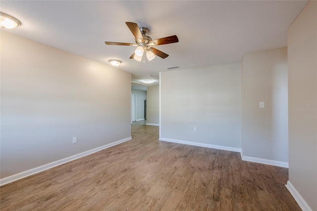 unfurnished room featuring ceiling fan and wood-type flooring