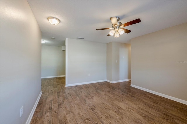 spare room featuring ceiling fan and hardwood / wood-style floors