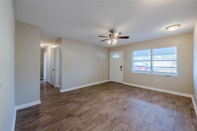 entrance foyer with ceiling fan and dark hardwood / wood-style floors