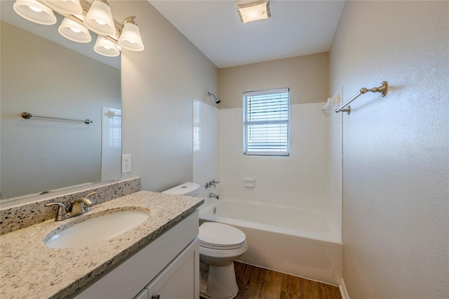 full bathroom with shower / bathing tub combination, vanity, toilet, and hardwood / wood-style flooring