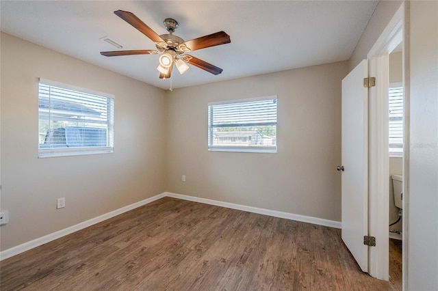 unfurnished room featuring hardwood / wood-style floors and ceiling fan