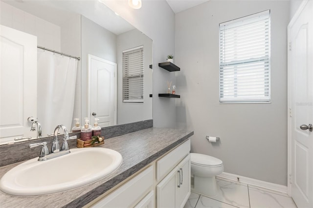 bathroom with vanity and toilet