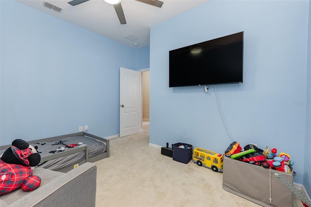 playroom with ceiling fan and carpet floors