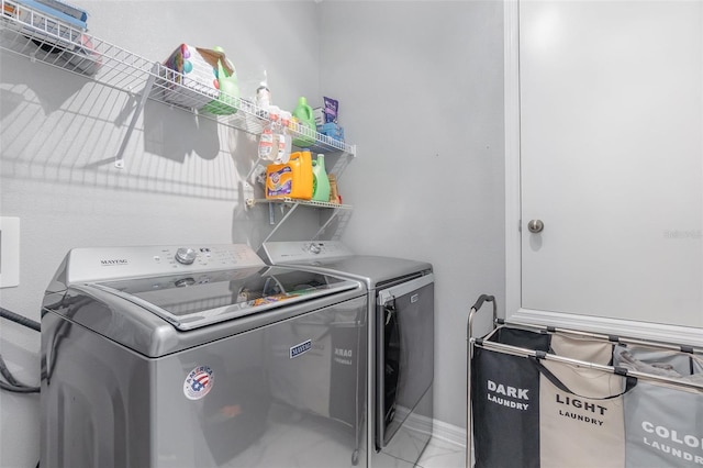 washroom featuring washer and dryer