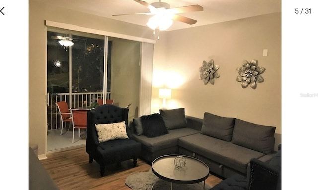 living room with ceiling fan and wood-type flooring