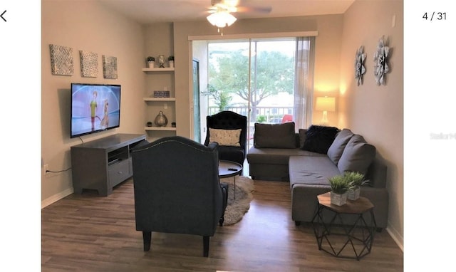 living room with ceiling fan and dark hardwood / wood-style floors