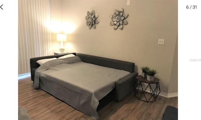 bedroom featuring dark wood-type flooring