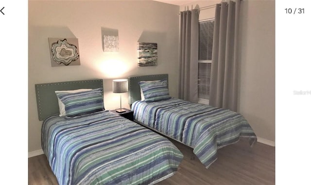 bedroom featuring wood-type flooring