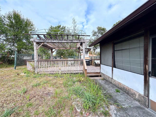 exterior space with a deck and a pergola